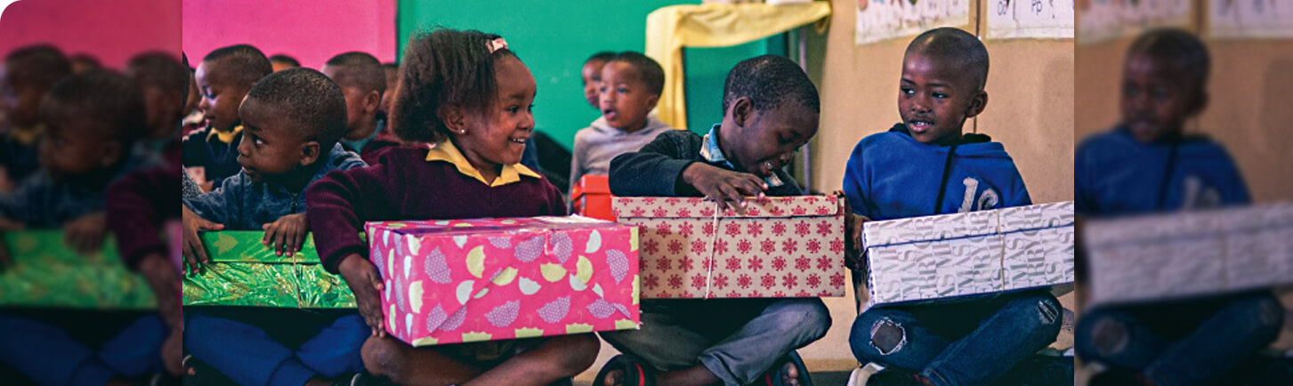 Book Dash children unwrapping books